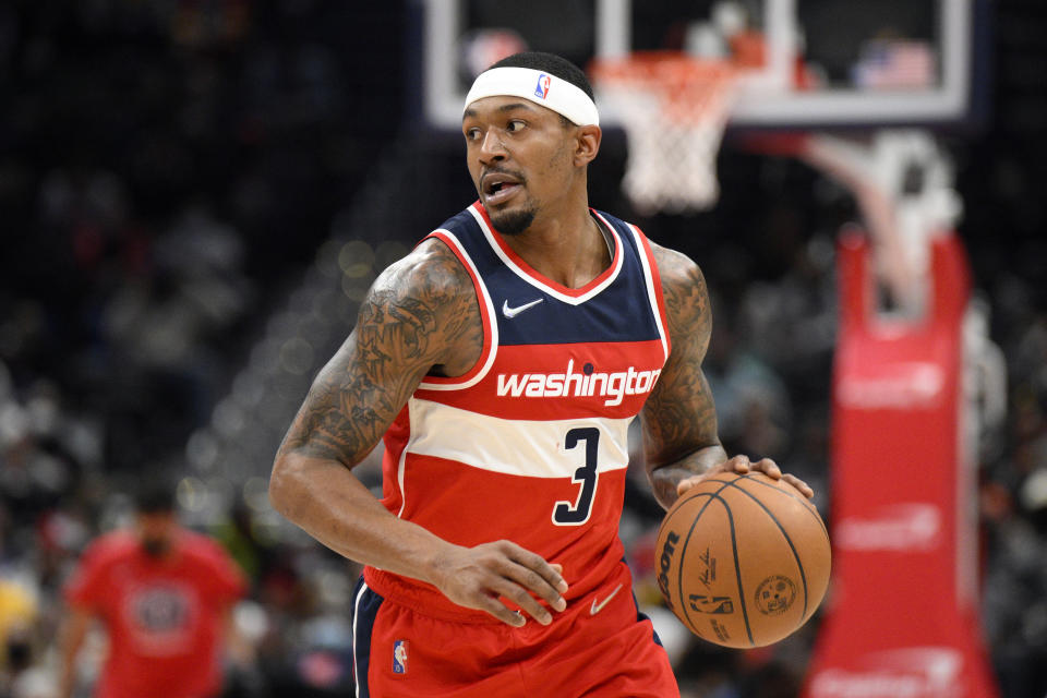 FILE - Washington Wizards guard Bradley Beal (3) dribbles during the first half of an NBA basketball game against the Cleveland Cavaliers, on Dec. 30, 2021, in Washington. Beal and the Wizards renewed their commitment to each other when he agreed to a five-year deal worth up to $251 million to stay in Washington. (AP Photo/Nick Wass, File)