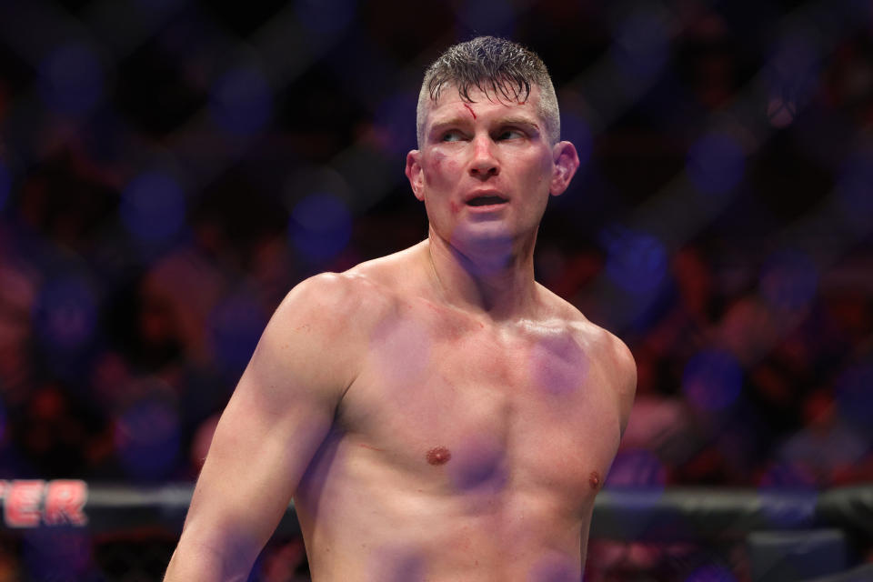 Dec 3, 2022; Orlando, Florida, USA; Stephen Thompson (red gloves) reacts after fighting Kevin Holland (blue gloves) during UFC Fight Night at Amway Center. Mandatory Credit: Nathan Ray Seebeck-USA TODAY Sports