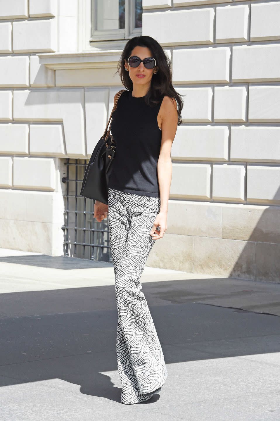 <p>The Upper East Side made the perfect backdrop for Amal's Giambattista Valli printed pants.</p>