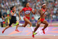 <a href="http://sports.yahoo.com/olympics/track-field/allyson-felix-1132858" data-ylk="slk:Allyson Felix;elm:context_link;itc:0;sec:content-canvas" class="link ">Allyson Felix</a> of the United States and Toea Wisil of Papua New Guinea competes in the Women's 100m Round 1 Heats on Day 7 of the London 2012 Olympic Games at Olympic Stadium on August 3, 2012 in London, England.