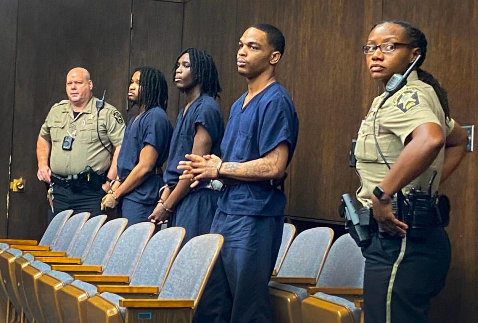 From L-R in center, defendants Vic’trez Jaequan Thomas, Jyquarious Varner and Cecil Brian Berguin III wait for a plea hearing to begin Thursday morning in before Superior Court Judge John Martin in Columbus.