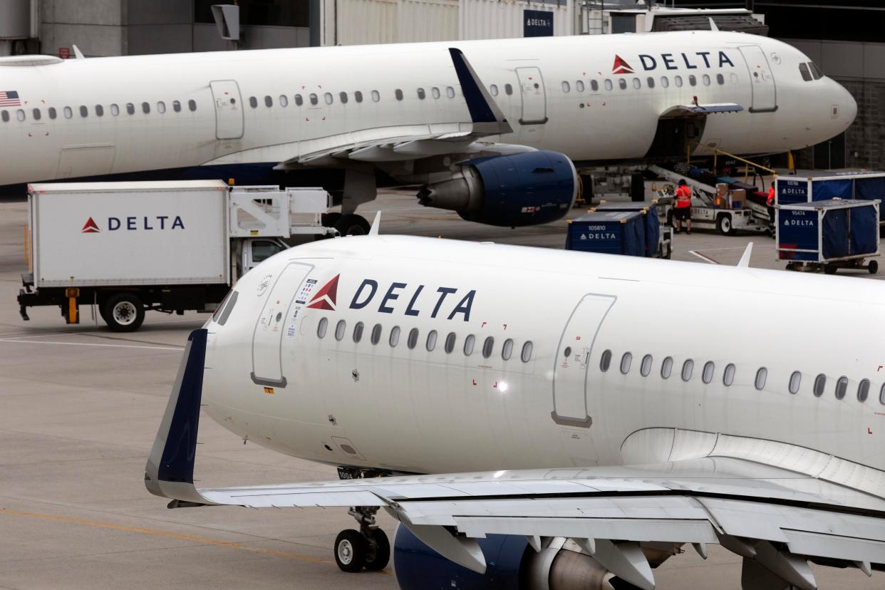 A Delta aircraft leaves its gate.