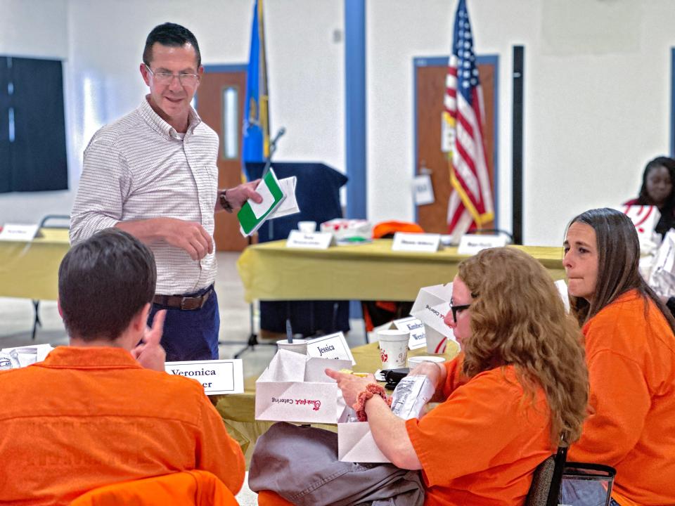 Kris Steele, standing, the former speaker of the Oklahoma House of Representatives, speaks with inmates of Mabel Bassett Correctional Center.