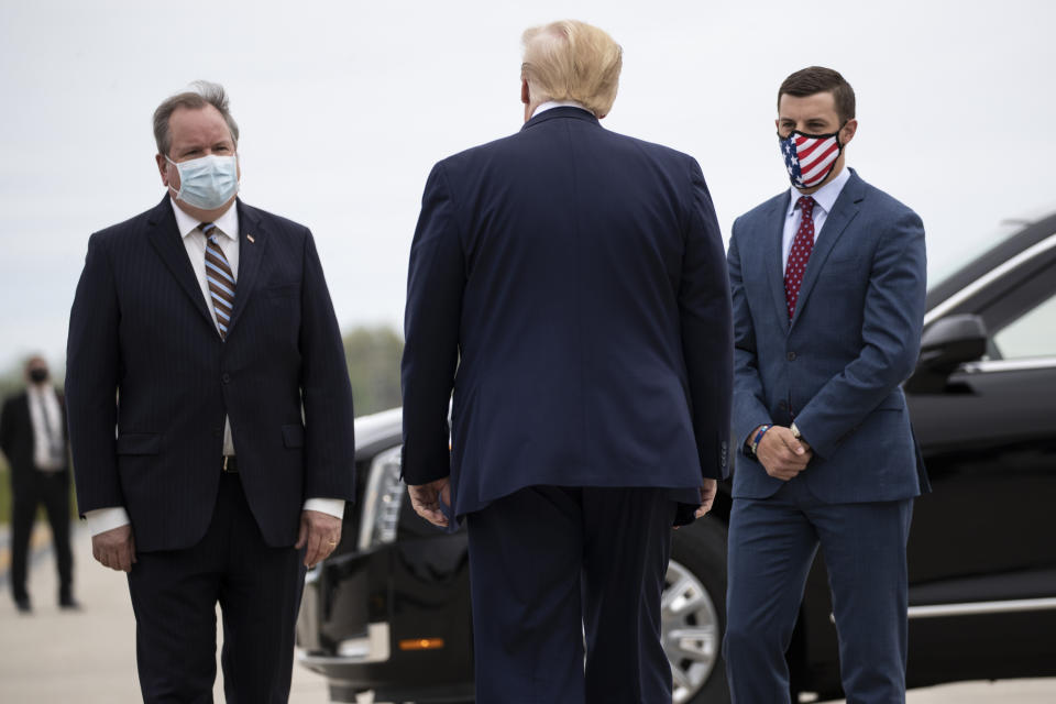 FILE - In this May 21, 2020, file photo, President Donald Trump is greeted by Kurt Heise, left, Supervisor of Plymouth Township, Mich., and Speaker Lee Chatfield, of the Michigan House of Representatives after stepping off Air Force One as he arrives at Detroit Metro Airport in Detroit. President Donald Trump summoned Michigan's Republican legislative leaders Chatfield and Senate Majority Leader Mike Shirkey, to the White House for a meeting Friday, Nov. 20, amid a GOP push to overturn the certification of Democrat Joe Biden's victory in the battleground state. (AP Photo/Alex Brandon, File)