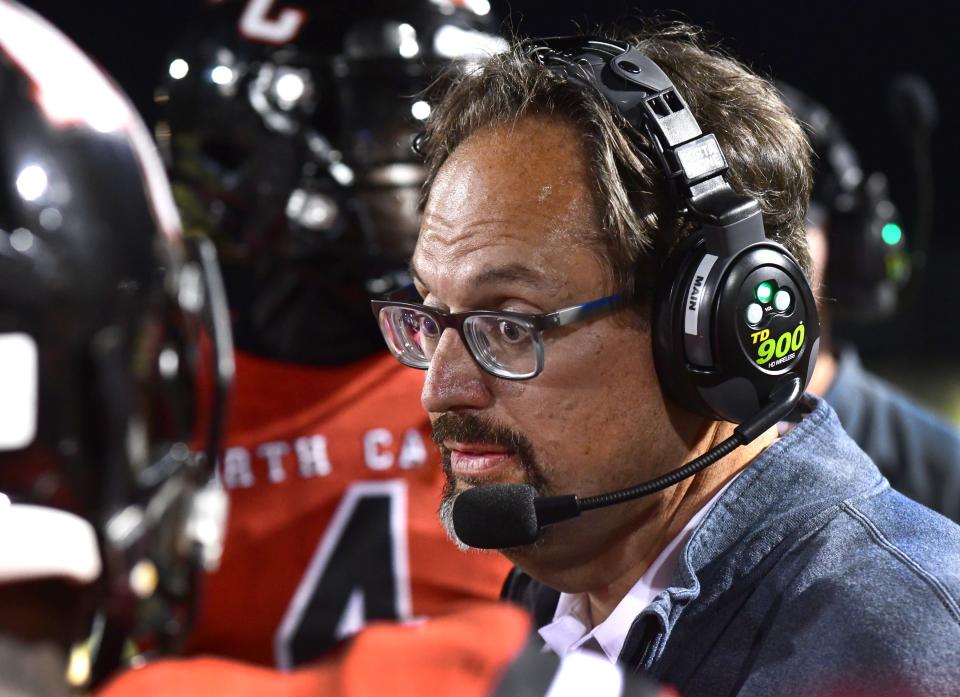 North Caddo's Head Coach John Kavanaugh talks to his players during his game against Calvary.