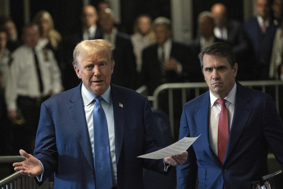 Former President Donald Trump, with his attorney Todd Blanch at his side, speaks to reporters as he arrives for his trial at Manhattan Criminal Court, Thursday, May 9, 2024, in New York. (Victor J. Blue/The Washington Post via AP, Pool)