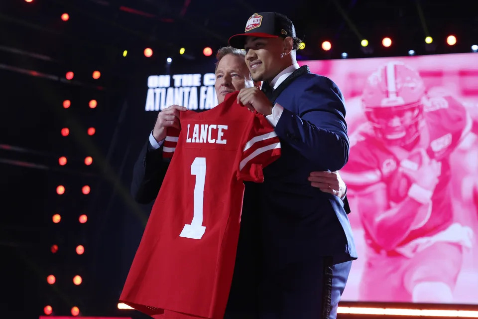 Trey Lance poses with NFL commissioner Roger Goodell onstage after being selected third by the San Francisco 49ers during the 2021 NFL draft. (Photo by Gregory Shamus/Getty Images)