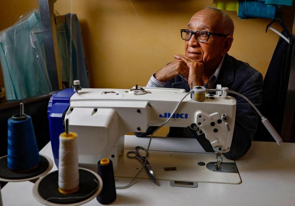 Fidel Aquino, owner and tailor at Sastreria & Confecciones Aquino, works in his shop in Allapattah on Wednesday, Sept. 20, 2023. on one of his new sewing machines.