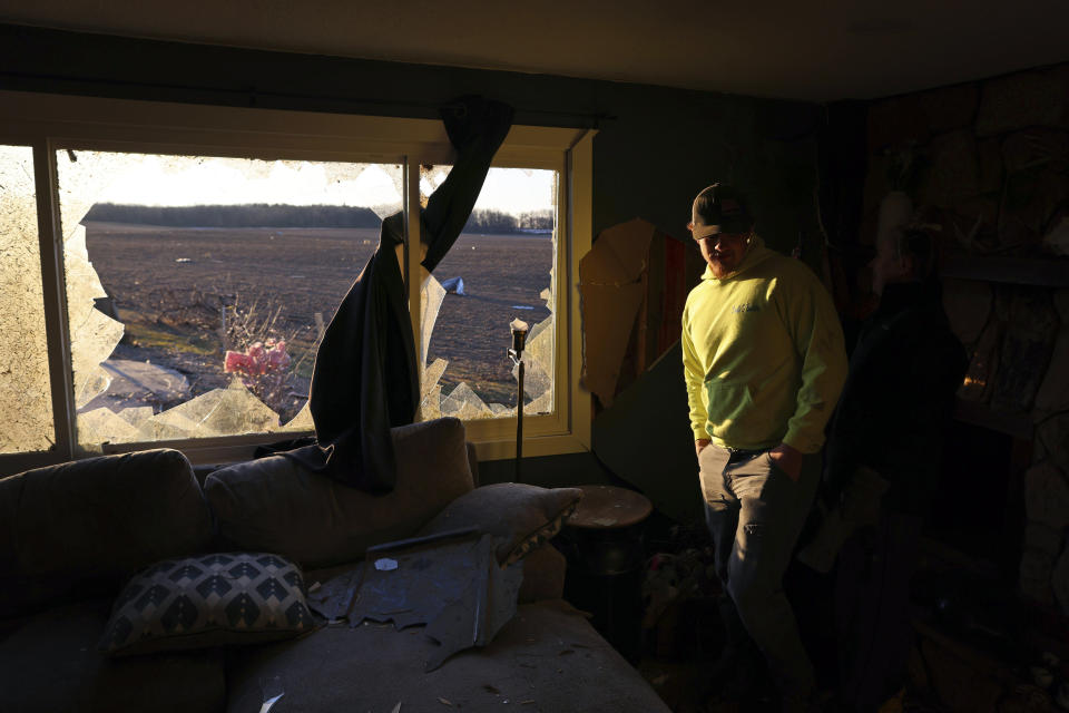 Patrick Crull tours the damage inside his home along North Tolles Road, Friday morning, Feb. 9, 2024, after a confirmed tornado went through the area just northwest of Evansville, Wis., the prior evening. The tornado was the first-ever reported in February in the state of Wisconsin, according to the National Weather Service. (Anthony Wahl//The Janesville Gazette via AP)