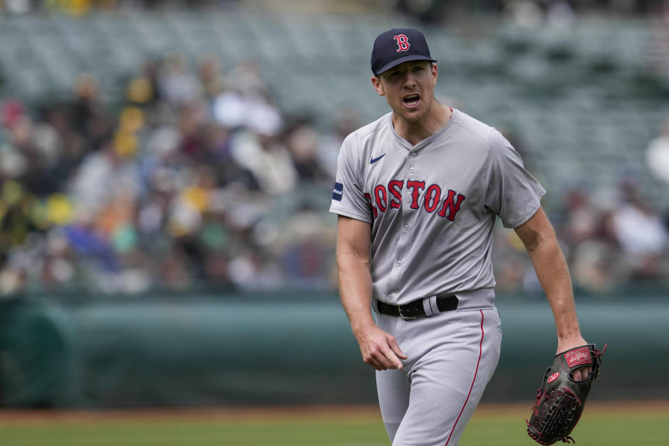 Boston Red Sox pitcher Nick Pivetta reacts after second baseman Enmanuel Valdez turned a double play with the bases loaded against the Oakland Athletics to end the fifth inning of a baseball game Wednesday, April 3, 2024, in Oakland, Calif. (AP Photo/Godofredo A. Vásquez)