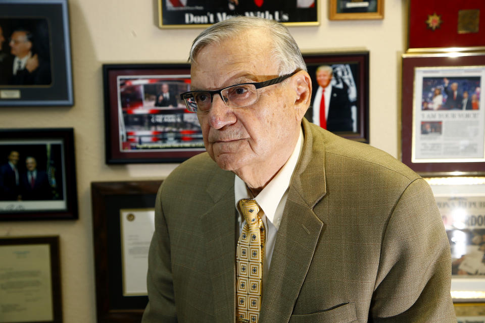 FILE- In this Aug. 26, 2019 file photo former Arizona Maricopa County Sheriff Joe Arpaio poses for a picture in his office in Fountain Hills, Ariz. Arpaio is aiming to get back his previous job as metro Phoenix’s sheriff even though he could easily walk away from politics and enjoy retirement. The former six-term sheriff denies he's running to stroke his ego, quench a thirst for publicity or lessen any boredom he might be experiencing. Instead, the 87-year-old says he wants to do whatever he can to help President Donald Trump and vows to bring back his immigration crackdowns and complex of jail tents. (AP Photo/Ross D. Franklin, File)