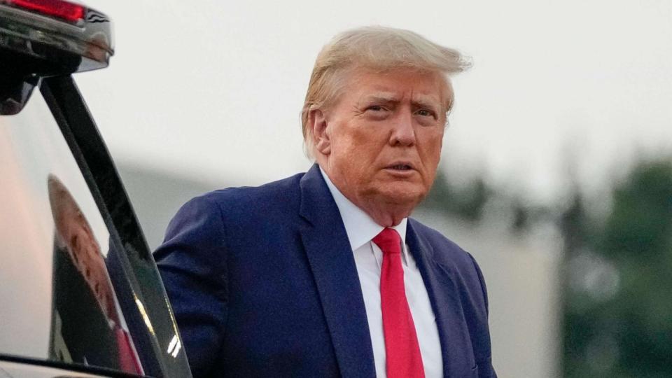 PHOTO: Former President Donald Trump walks to speak with reporters before departure from Hartsfield-Jackson Atlanta International Airport, Aug. 24, 2023, in Atlanta. (Alex Brandon/AP)