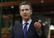 FILE - California Gov. Gavin Newsom gestures during an update June 26, 2020, in Rancho Cordova, Calif., on the coronavirus pandemic. Newsom said Monday, July 27, 2020, the state will spend $52 million to tackle the outbreak in eight Central Valley counties. He said the money will go toward helping improving isolation, quarantine, and testing policies and to helping health care workers. (AP Photo/Rich Pedroncelli, Pool, File)