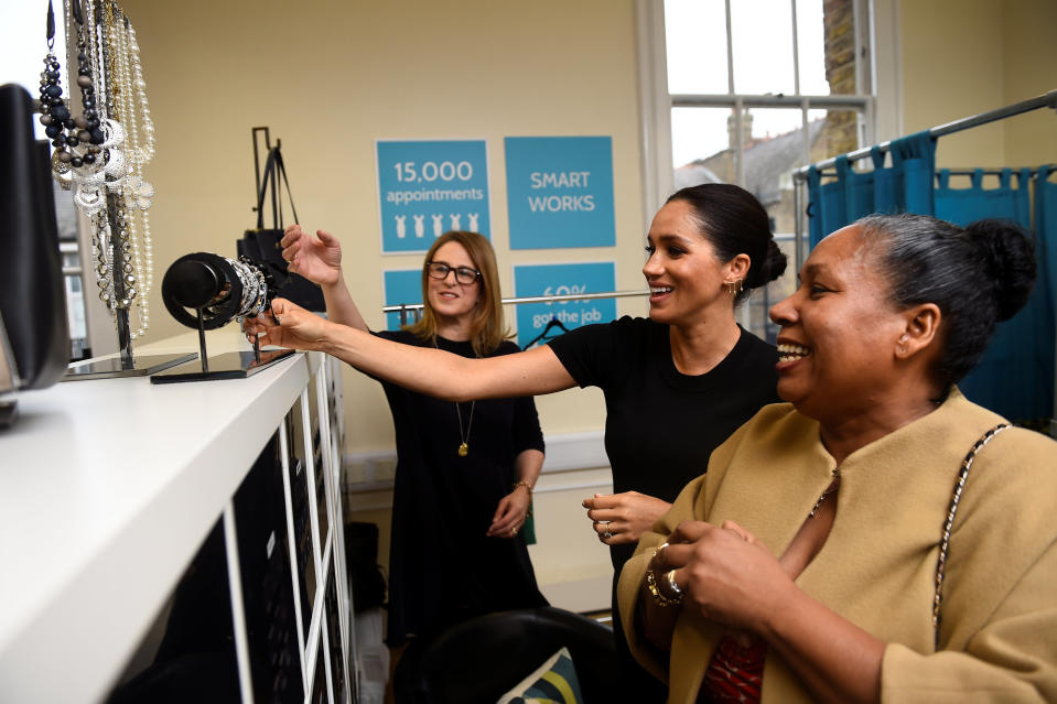 Meghan helps style Patsy Wardally during her visit in the week. Photo: Getty