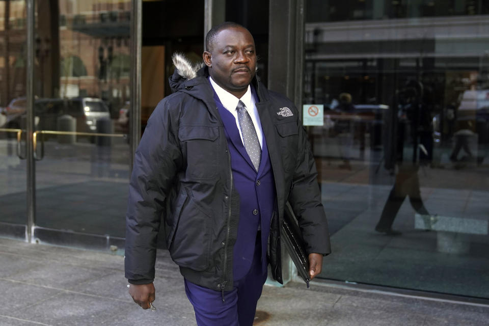 Former Haitian Mayor Jean Morose Viliena departs federal court, Monday, March 20, 2023, in Boston. Viliena, a lawful permanent resident of the U.S. who now lives in Malden, Mass., was sued by three Haitian citizens who say they or their relatives were persecuted by him and his political allies. (AP Photo/Steven Senne)