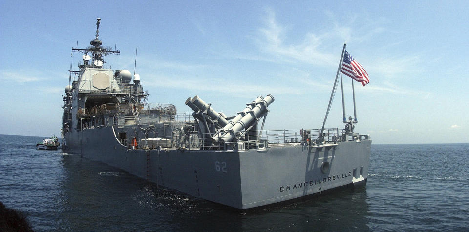 FILE - In this Sept. 27, 2002 file photo, the U.S. guided missile cruiser USS Chancellorsville lies at anchor in India's southern port of Cochin. The U.S. and Russian militaries accused each other of unsafe actions on Friday, June 7, 2019, after the USS Chancellorsville and a Russian destroyer came within 165 feet (50 meters) of each other in the East China Sea. (AP Photo, File)