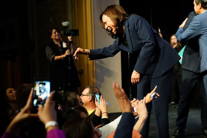 Kamala Harris waves to supporters on stage at a First in the West Event at the Bellagio Hotel in Las Vegas