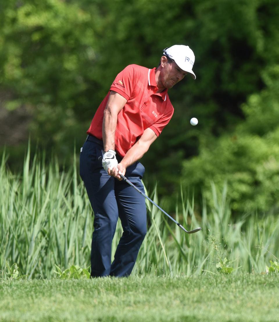 Mike Weir chips onto the 17th green during the third round of the Senior PGA Championship golf tournament at Harbor Shores in Benton Harbor, Mich., Saturday, May 28, 2022. (Don Campbell/The Herald-Palladium via AP)