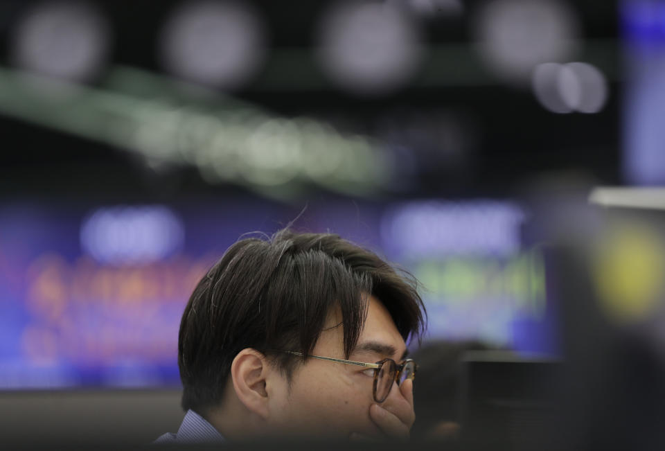 A currency trader watches the computer monitors at the foreign exchange dealing room in Seoul, South Korea, Monday, July 1, 2019. Asian markets took heart Monday from revived hopes for progress in trade negotiations between the U.S. and China after President Donald Trump met with China's Xi Jinping at the Group of 20 summit in Japan. (AP Photo/Lee Jin-man)