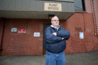 Unemployed autoworker Donald Coy, who was laid off from Ross's auto-parts plant, when it closed its doors in December 2016, is pictured in front of the former manufacturing plant in Canton, Ohio, U.S., January 14, 2017. REUTERS/Aaron Josefczyk