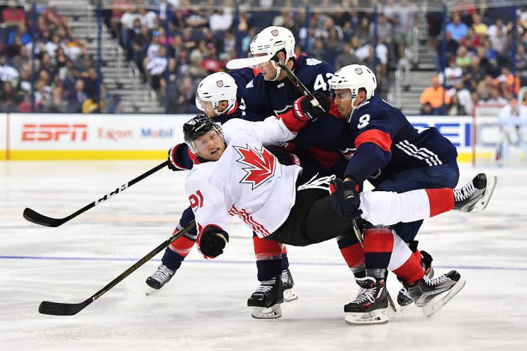 COLUMBUS, OH - SEPTEMBER 9: Steven Stamkos #91 of Team Canada is knocked to the ice by Matt Niskanen #2 of Team USA during the third period of an exhibition game on September 9, 2016 at Nationwide Arena in Columbus, Ohio. Team USA defeated Team Canada 4-2. (Photo by Jamie Sabau/World Cup of Hockey via Getty Images)