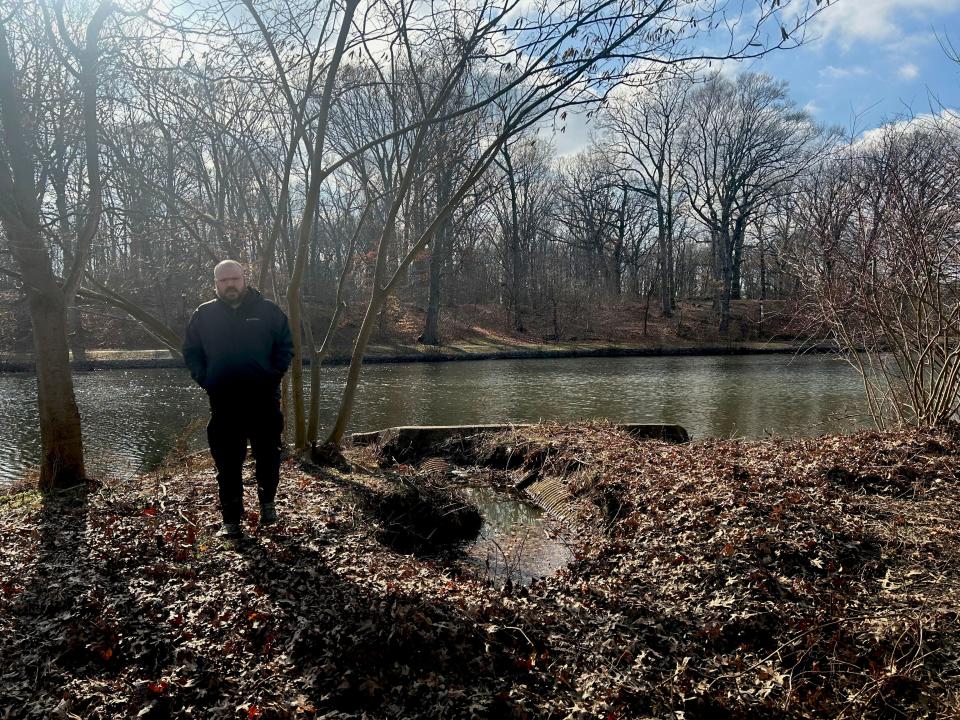 Scott Schreiber, executive director of the Camden County Municipal Utilities Authority, walks near a pipe in need of repair along the Newton Creek in Haddon Township.