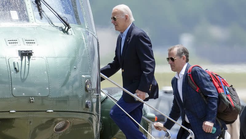 President Joe Biden boards Marine One with his son Hunter Biden as he leaves Andrews Air Force Base, Md., on his way to Camp David, Saturday, June 24, 2023.