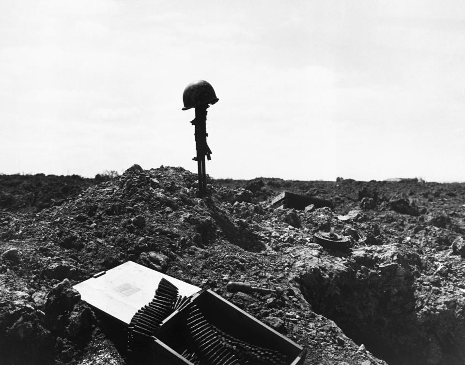 This monument to an unidentified American soldier who died in the D-Day assault was placed on the shell-blasted shore of Normandy, France, after the invasion in June 1944. (Photo: Corbis via Getty Images)