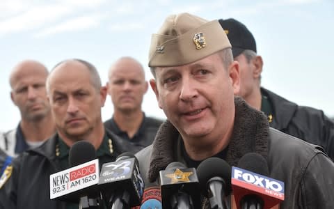 Navy Capt. Tim Kinsella briefs members of the media following a shooting at the Naval Air Station in Pensacola, Fla., Friday, Dec. 6, 2019. The US Navy is confirming that a shooter is dead and several injured after gunfire at the Naval Air Station in Pensacola. - Credit: Pensacola News Journal