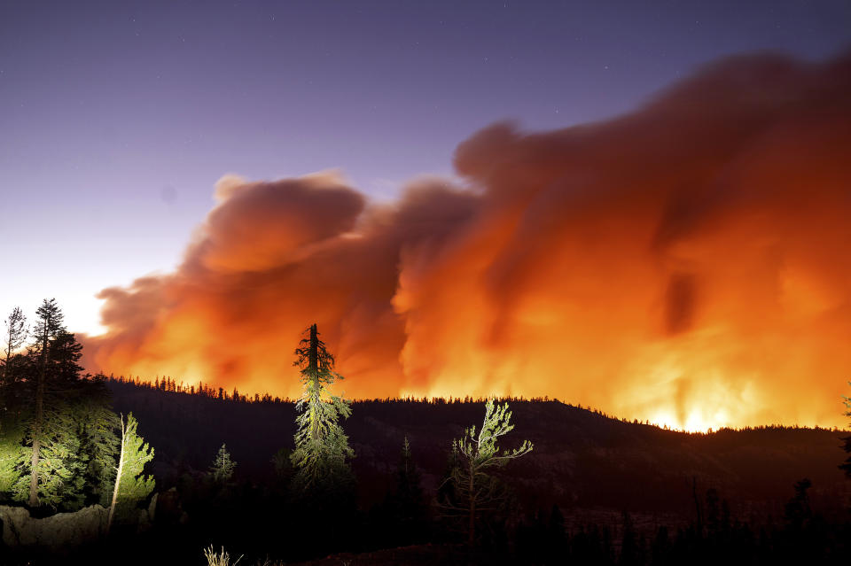 FILE - Seen in a long camera exposure, the Caldor Fire burns on Aug. 29, 2021, in Eldorado National Forest, Calif. Scientists say forest is disappearing as increasingly intense fires alter landscapes around the planet, threatening wildlife, jeopardizing efforts to capture climate-warming carbon and harming water supplies. (AP Photo/Noah Berger, File)