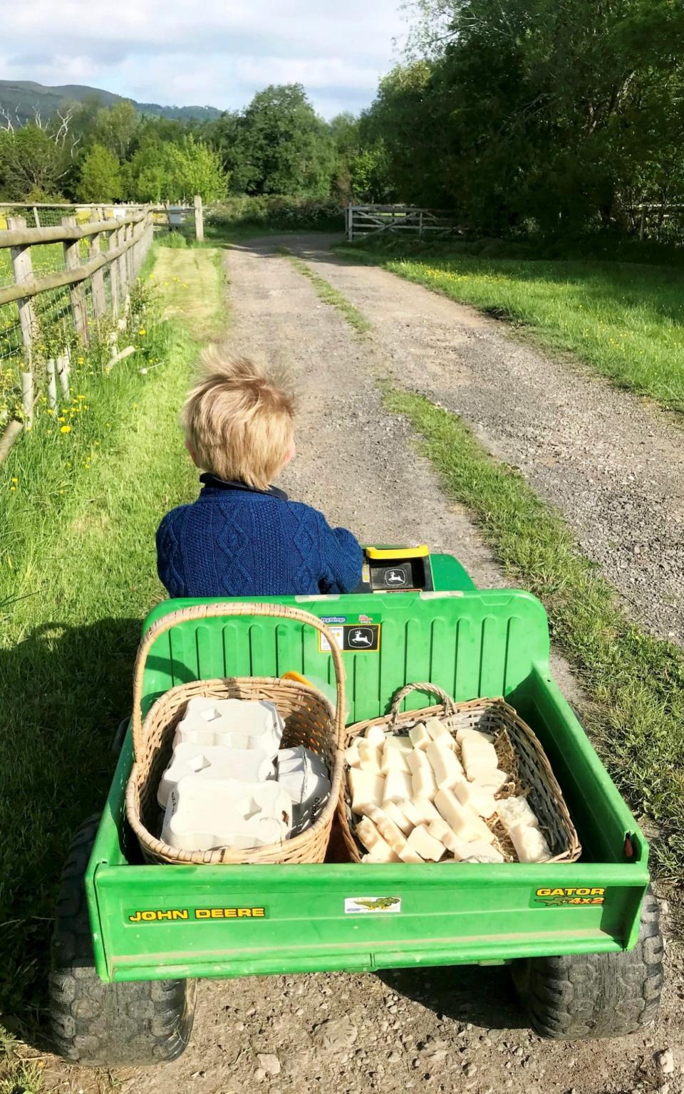 Every morning little Harry goes to restock before school and retrieve any takings which have been left inside the honesty box. - SWNS