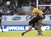 Australia's Jordan Petaia is tackled by New Zealand's Anton Lienert-Brown during the second Bledisloe Rugby test between the All Blacks and the Wallabies at Eden Park in Auckland, New Zealand, Sunday, Oct. 18, 2020. (AP Photo/Mark Baker)