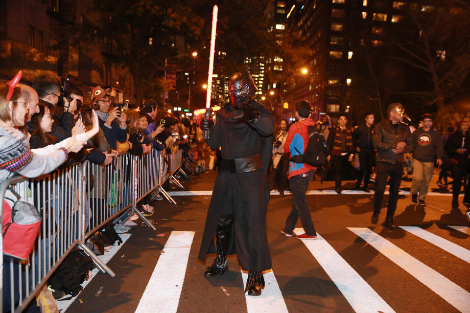 <p>“Kylo Ren” uses the dark side to get his photo taken in 44th annual Village Halloween Parade in New York City on Oct. 31, 2017. (Photo: Gordon Donovan/Yahoo News) </p>