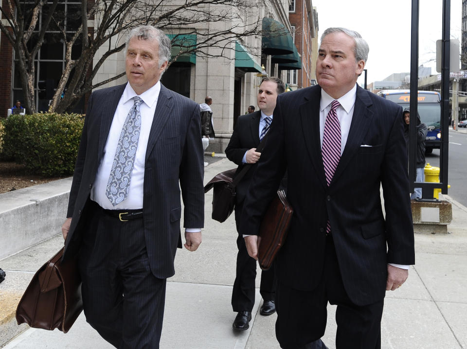 Former Connecticut Gov. John G. Rowland, right, arrives with attorney Reid Weingarten at federal court, Friday, April 11, 2014, in New Haven, Conn. A grand jury on Thursday returned a seven-count indictment alleging Rowland schemed to conceal involvement with congressional campaigns. (AP Photo/Jessica Hill)