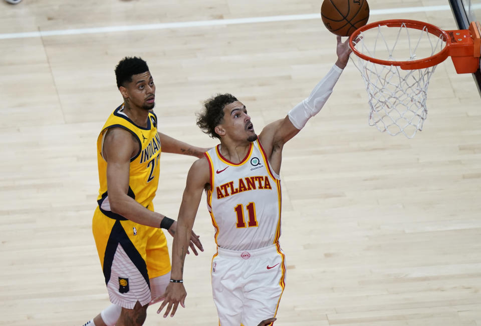 Atlanta Hawks Trae Young (11) shoots and scores during the second half of an NBA basketball game against the Indiana Pacers on Sunday, April 18, 2021, in Atlanta. (AP Photo/Brynn Anderson)
