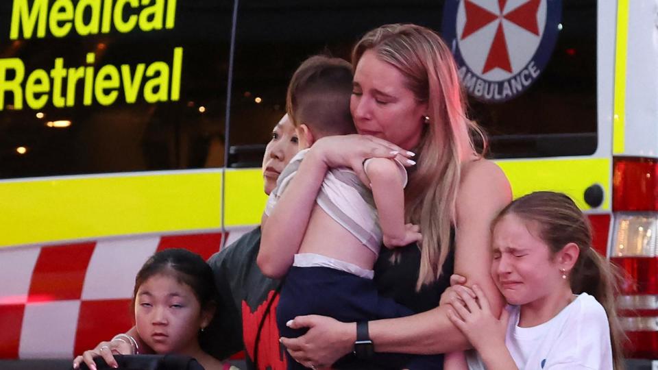 PHOTO: A family leaves the Westfield Bondi Junction shopping mall after a stabbing incident in Sydney, on April 13, 2024.  (David Gray/AFP via Getty Images)