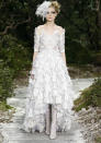 <b>Chanel SS13</b>: A full, tiered feather skirt highlighted this delicate design.<br><br>© Reuters