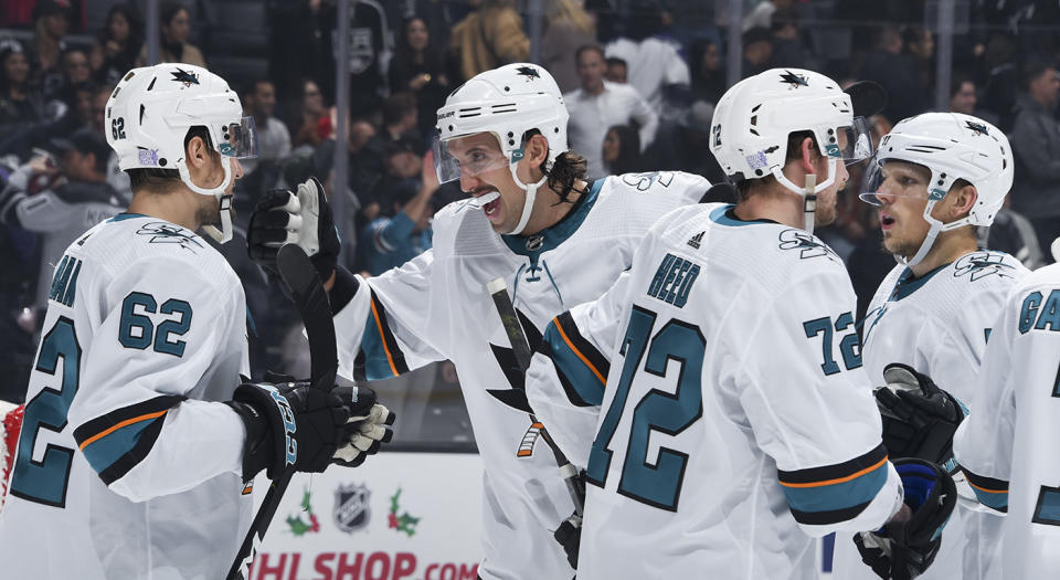 LOS ANGELES, CA - NOVEMBER 25:  Brenden Dillon #4 of the San Jose Sharks celebrates San Jose Sharks win with teammates during overtime against the Los Angeles Kings at STAPLES Center on November 25, 2019 in Los Angeles, California. (Photo by Adam Pantozzi/NHLI via Getty Images)