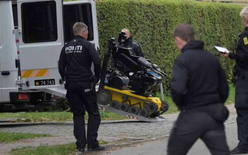 Police officers used a bomb-defusing robot - Ritzau Scanpix/Nils Meilvang via REUTERS