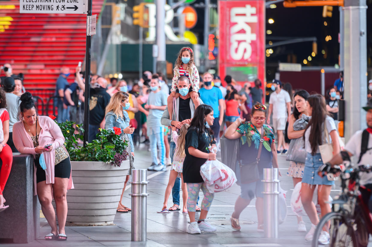 NEW YORK, NEW YORK - JULY 01: People fill Times Square as New York City moves into Phase 2 of re-opening following restrictions imposed to curb the coronavirus pandemic on July 1, 2020. Phase 2 permits the reopening of offices, in-store retail, outdoor dining, barbers and beauty parlors and numerous other businesses. Phase 2 is the second of four phased stages designated by the state. (Photo by Noam Galai/Getty Images)