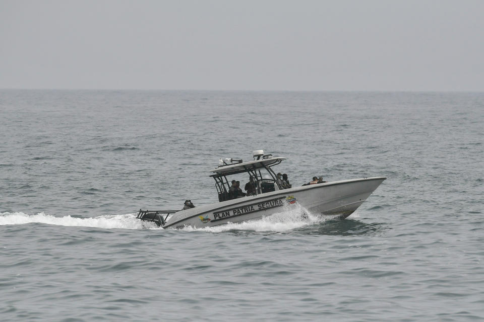 Security forces patrol in the port city of La Guaira, Venezuela, Sunday, May 3, 2020. Interior Nestor Reverol said on state television that security forces overcame before dawn Sunday an armed maritime incursion with speedboats from neighboring Colombia in which several attackers were killed and others detained. (AP Photo/Matias Delacroix)