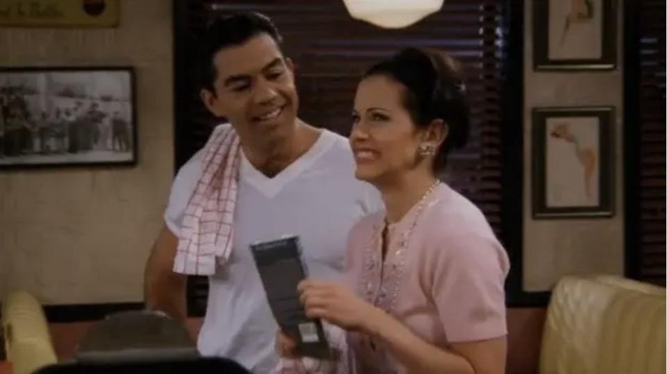 Julio smiling and Phoebe grimacing