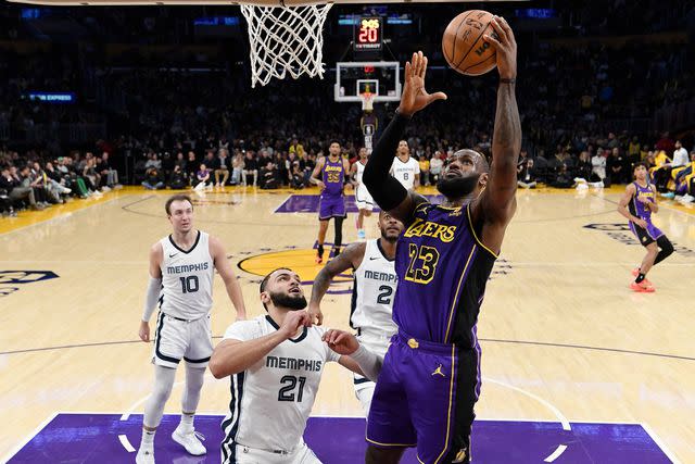 <p>Kevork Djansezian/Getty</p> LeBron James playing for the Lakers