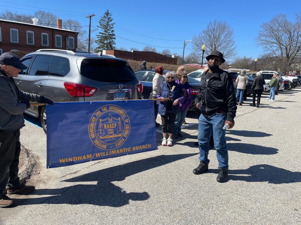 Members of the NAACP's Windham/Willimantic branch rally in front of Danielson Superior Court on Monday.