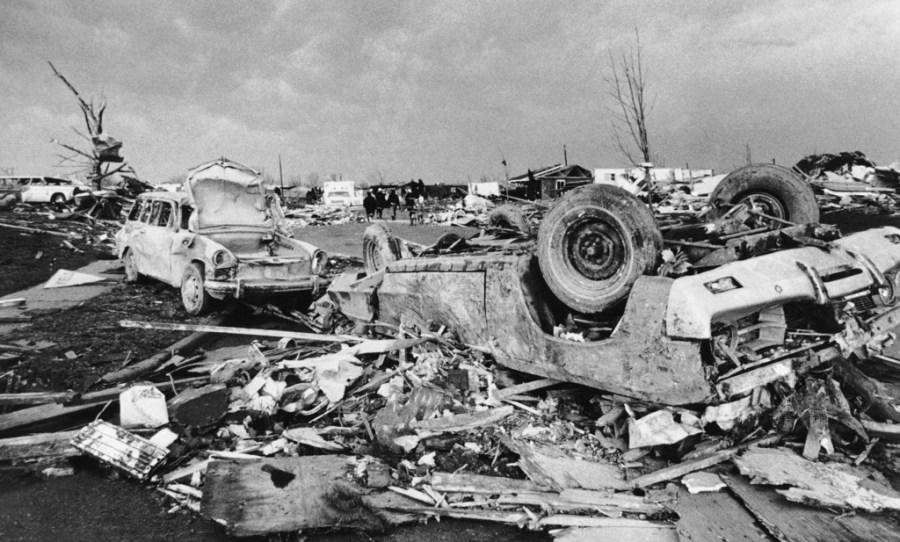 FILE – Cars and debris is strewn over Xenia, Ohio after a tornado ripped through the area on April 4, 1974. The deadly tornado killed 32 people, injured hundreds and leveled half the city of 25,000. Nearby Wilberforce was also hit hard. As the Watergate scandal unfolded in Washington, President Richard Nixon made an unannounced visit to Xenia to tour the damage. Xenia’s was the deadliest and most powerful tornado of the 1974 Super Outbreak. (AP Photo)