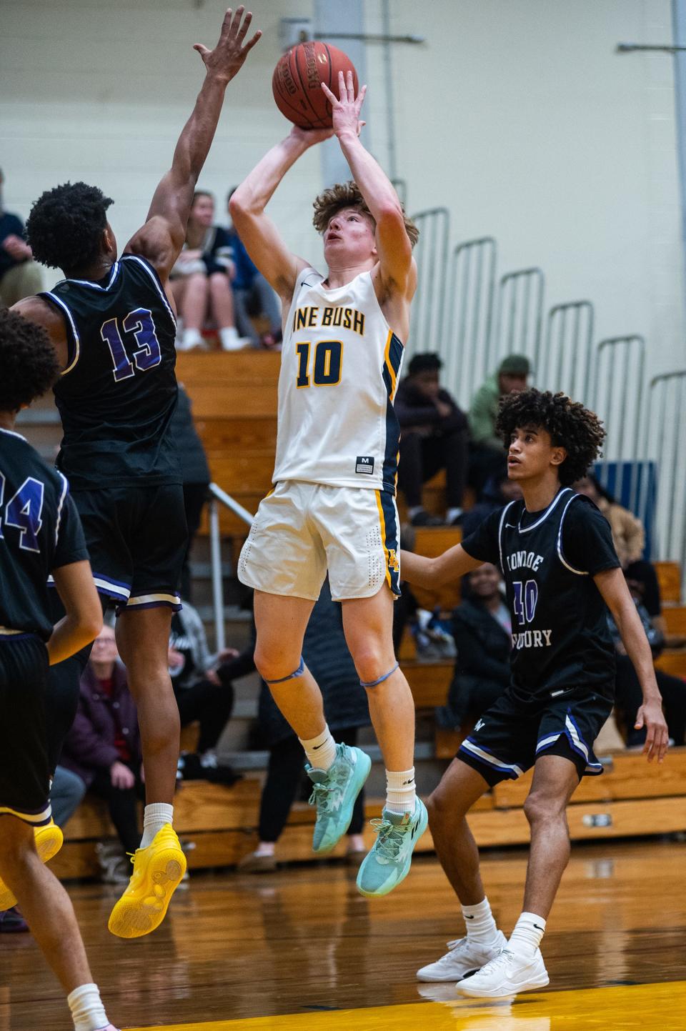 Pine Bush's Robert Lawrence, center, shoots during the Section 9 boys basketball at Pine Bush High School in Pine Bush, NY on Friday, January 5, 2026. Monroe-Woodbury defeated Pine Bush 94-43. KELLY MARSH/FOR THE TIMES HERALD-RECORD