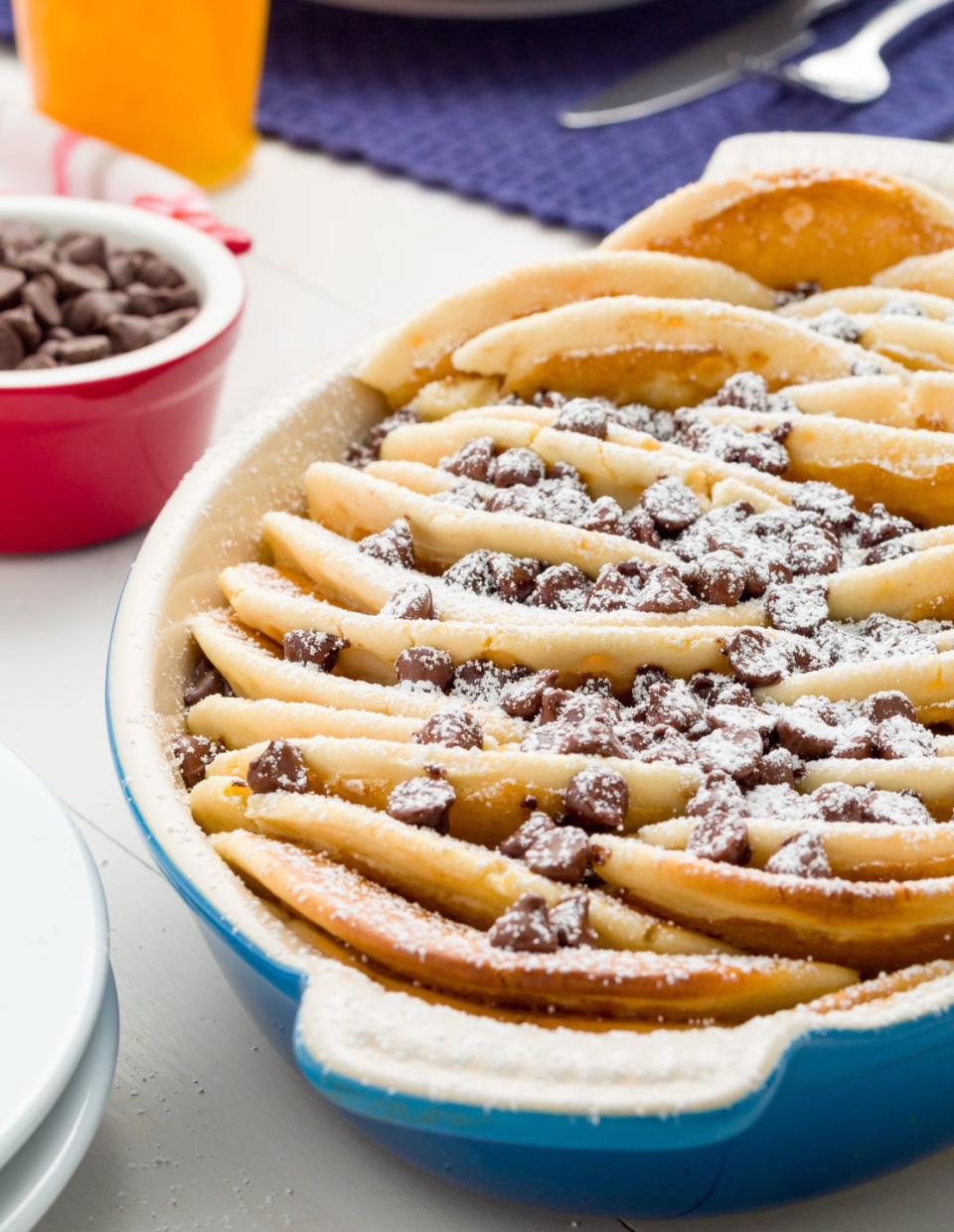 <p>If chocolate chips weren't enough, we showered layers of this fluffy pancake casserole in powdered sugar. You're welcome. </p><p>Get the <strong><a href="https://www.delish.com/cooking/recipe-ideas/recipes/a45036/chocolate-chip-pancake-casserole-recipe/" rel="nofollow noopener" target="_blank" data-ylk="slk:Chocolate Chip Pancake Casserole recipe;elm:context_link;itc:0;sec:content-canvas" class="link ">Chocolate Chip Pancake Casserole recipe</a>. </strong></p>