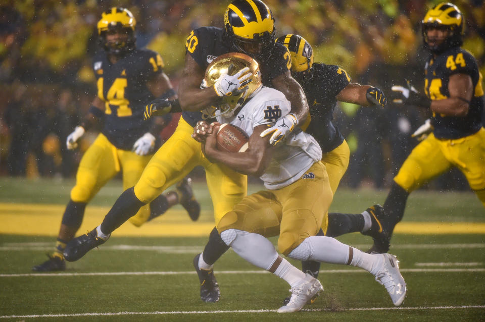 ANN ARBOR, MICHIGAN - OCTOBER 26: Defensive back Brad Hawkins #20 of the Michigan Wolverines tackles a Notre Dame player during a college football game against the Notre Dame Fighting Irish at Michigan Stadium on October 26, 2019 in Ann Arbor, Michigan. (Photo by Aaron J. Thornton/Getty Images)