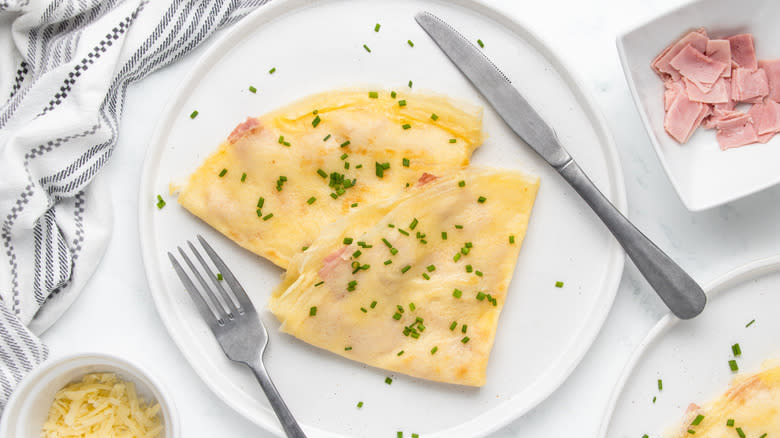 cheese and ham crepes on plate