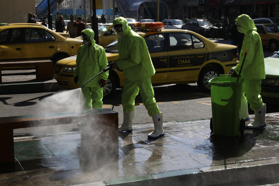 City workers disinfect a bench because of the new coronavirus in Tehran, Iran, Thursday, March 5, 2020. Iran has one of the highest death tolls in the world from the new coronavirus outside of China, the epicenter of the outbreak. (AP Photo/Vahid Salemi)